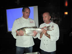 Chefs Tim Creehan (left) and Phillipe Parola with a bighead carp